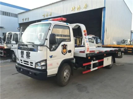 ISUZU 600P flatbed road wrecker with loading plate visible
