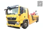 SINOTRUK HOWO 6X4 wrecker tow truck side view showing full chassis and lifting arm