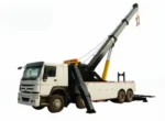 HOWO wrecker truck front three-quarter view showing cab and towing equipment