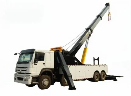 HOWO wrecker truck front three-quarter view showing cab and towing equipment