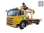FAW flatbed wrecker truck front three-quarter view