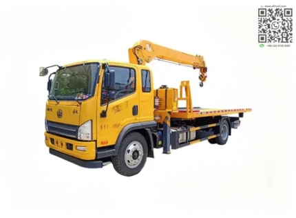 Flatbed tow truck with crane on chassis