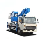 HOWO 28m aerial platform truck front three-quarter view showing the boom arm