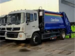 Rear loading hopper on compactor garbage truck