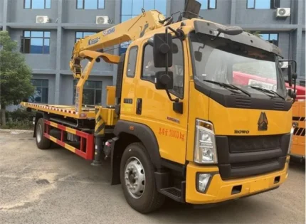 XCMG crane mounted on rear flatbed of HOWO tow truck