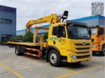 Flatbed loading platform with hydraulic ramp system