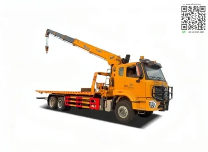 Hydraulic crane on flatbed recovery truck platform