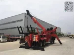 Hydraulic corbeling arm extended on tow truck rear section