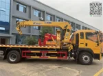 Side view of 3-ton HOWO flatbed with cargo box details