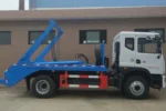Swing arm mechanism lifting rear container for loading