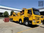 H-type front outrigger and L-type rear outrigger deployed on the rotator tow truck for stability
