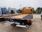 Winch and steel cable assembly on flatbed tow truck