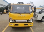 Rear towing arm assembly and two auxiliary support wheels