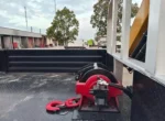 Hydraulic outriggers deployed on 6X4 boom truck crane