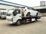 Warning lamp and accessories mounted on flatbed wrecker body