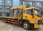 H-type support legs of XCMG crane on flatbed tow truck