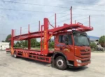 Hydraulic telescopic folding ladder on rear of car carrier