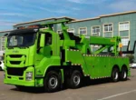 Rotary recovery truck performing vehicle recovery operation