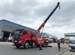 Rotator crane boom extended on the recovery truck
