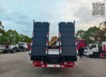 Knuckle boom articulated arm crane folded on truck