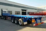 Two-speed manual landing gear on flatbed trailer front
