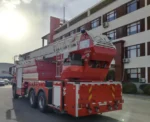 Fire truck with outriggers deployed for stability