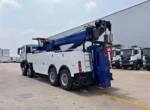 Underlift system with sliding mechanism on recovery truck