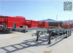 Container loaded on flatbed skeleton trailer deck surface