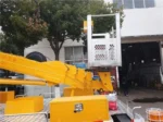 Telescopic boom truck in operation for maintenance work