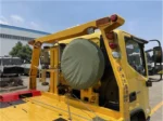 Carriage arm towing system on 3 ton flatbed wrecker truck