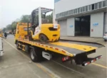 Rear view showing LED tail lights and side toolbox on flatbed