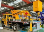 Rear view of truck showing aerial platform folded for transport
