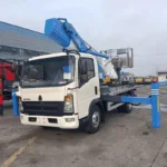 Operator inside the 200kg rated aerial platform bucket at elevated working position
